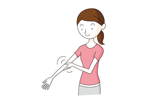 腕をもみほぐす